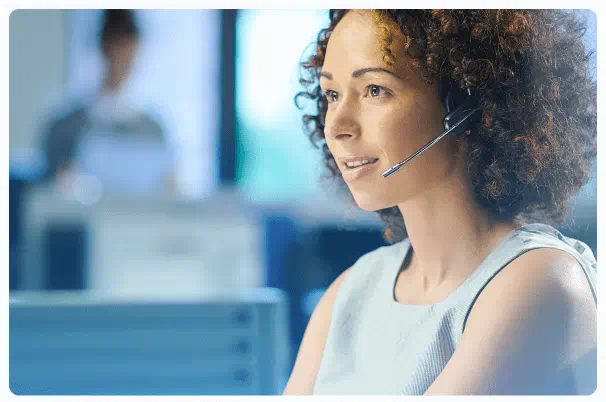 Female support team representative wearing a headset at HGM GLOBAL fx offices
